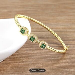 Elegant Gold and Green Bracelet